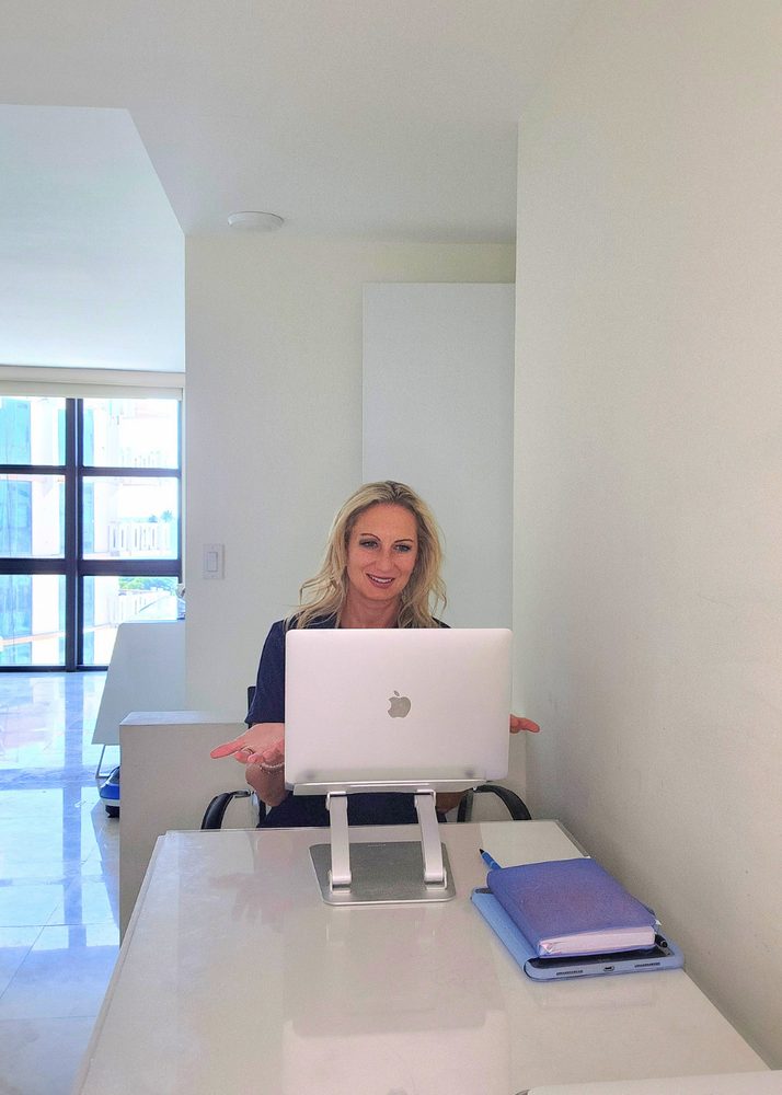 lori-desk-video-call Dr. Lori Kalie on a video consultation call at her desk